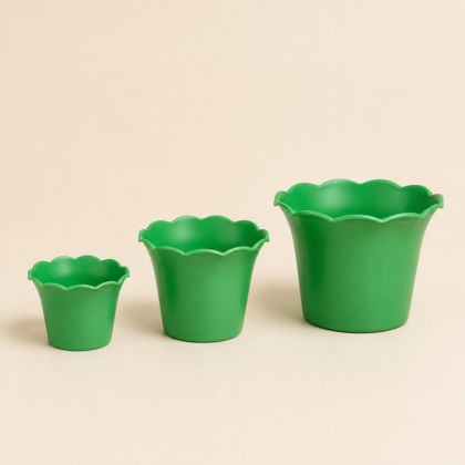 Three green Fulora Planters in varying sizes with scalloped rims on a neutral background.