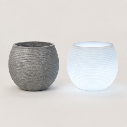 Two Globe Planters, one textured grey and one glowing white.