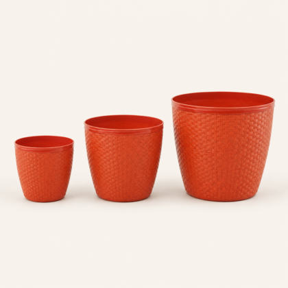 Three orange Heritage Planters in increasing sizes with a woven texture.