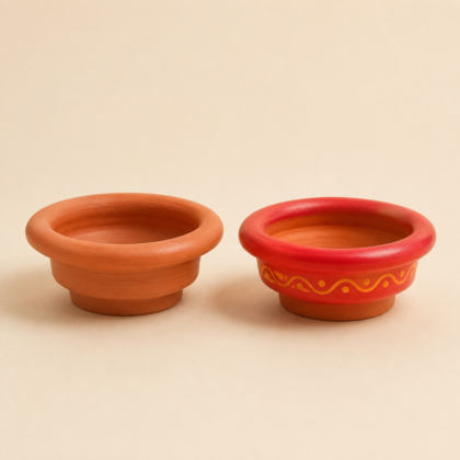 Two terracotta Kalash planters, one plain orange-brown and one red with yellow painted patterns.