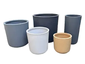 Group of five cylindrical garden planters in varying heights and neutral shades.